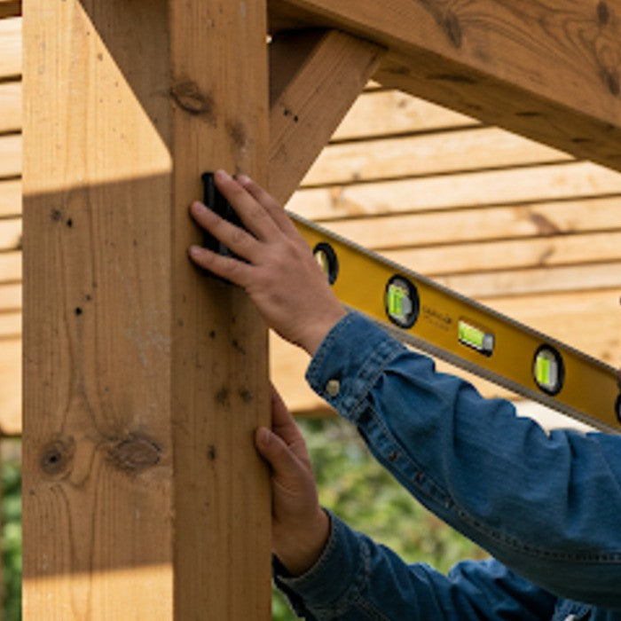 A man Building  Pergola and using a Level