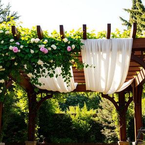 Wooden slatted lattice pergola, decorated with flowers and drapes