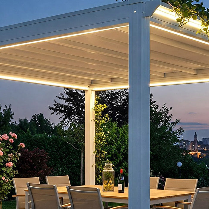 White electric pergola with lights over an outdoor dining set