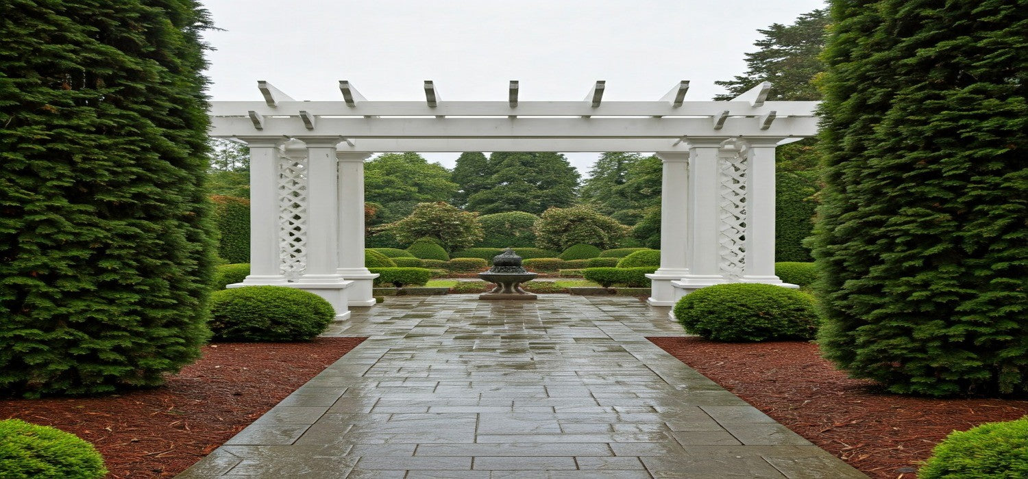 Large White Pergola within beautiful garden setting on a rainy day