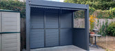 A dark grey aluminium BBQ storage shelter with louvre panels on back and sides