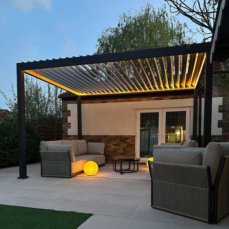 Aluminium pergola with LEd Lighting on and Rouf Louvres Open
