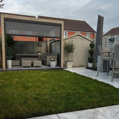 Garden with outdoor furniture, pergola, and greenery