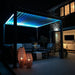 Aluminium pergola in the dark with Blue LED Lights on and a couple of teardrop lamps on on the floor. A very cosy scene