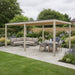Nova Titan Aluminium Pergola 6 x 3m in Wood Look on landscaped patio with furniture