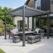 Nova Titan Aluminium Pergola in Grey - 3.6 x 3m lifestyle image on landscaped patio