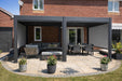 Nova Titan 5.3x3.6m aluminium pergola in grey with dining set and lounge seating