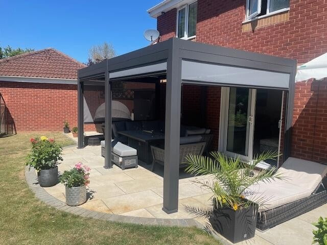 Nova Titan 5.3x3m aluminium pergola in grey customer image side view with privacy screens visible