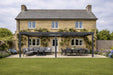 Nova Titan 6x3m Pergola in lifestyle setting with lounge and dining set